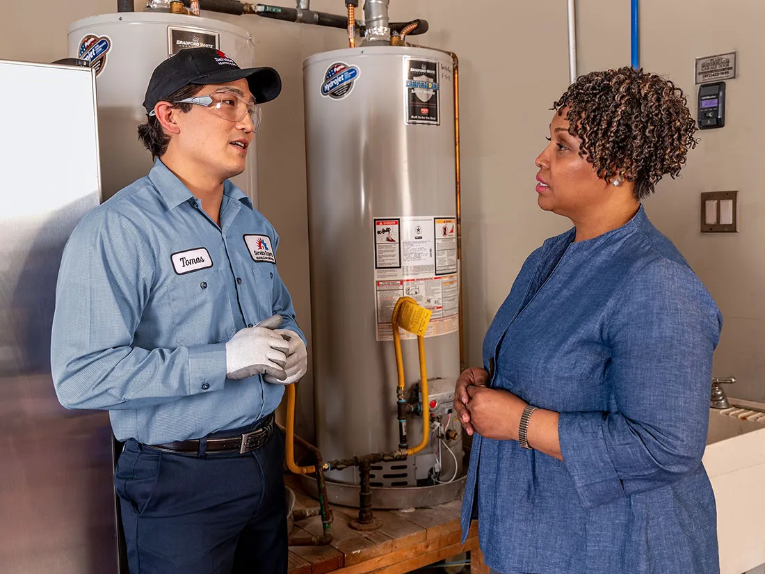 woman talking to a Service Experts technician