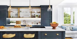 Kitchen with blue cabinets and yellow stools